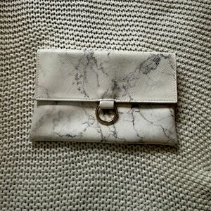 White-marble print faux leather clutch